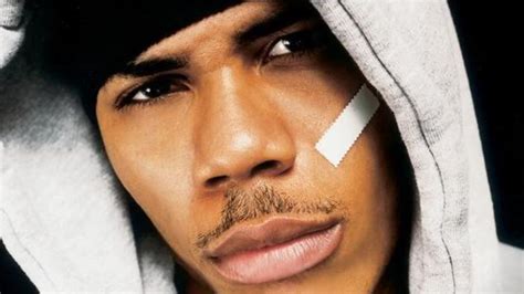 rapper with plaster on face|nelly wearing a plaster on cheek.